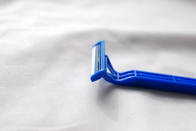 A blue razor used for shaving