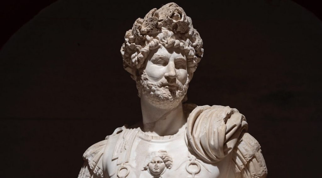 Statues of Emperor Hadrian, Roman emperor, standing tall in regal attire.
