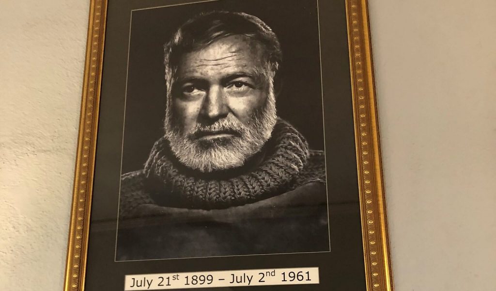 Black and white picture frame displaying a photograph of Ernest Hemingway, the esteemed writer.